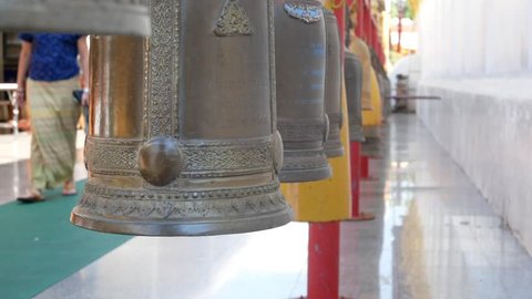 Bells Hanging in Buddhist Temple Wat Prathat Cho Hae Thailand.