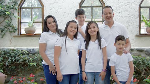 Hispanic family wearing white at home