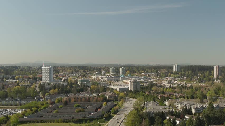 Aerial view of residential homes near Guildford Mall during a sunny day. Taken in Surrey, Greater Vancouver, British Columbia, Canada.