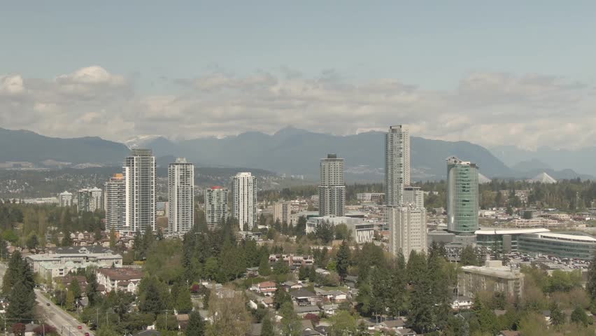 Aerial view of buildings near Surrey Central Mall during a sunny day. Taken in Greater Vancouver, British Columbia, Canada.