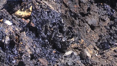 Soil contaminated with oil and other toxic materials. Environment pollution. Closeup shot.