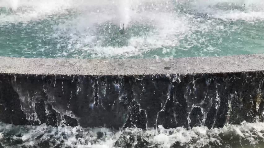 Water of dry fountain in the park close-up