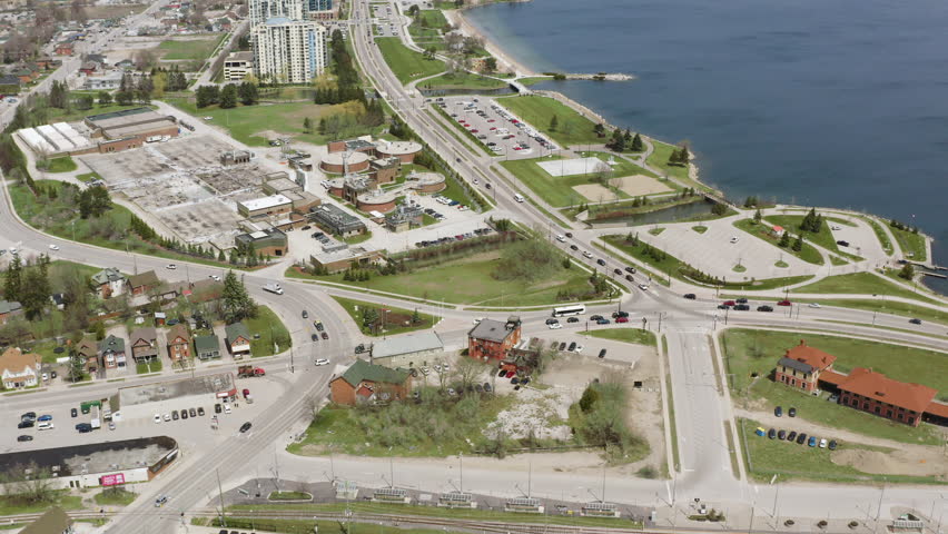 Barrie Ontario Canada 4k Aerial Drone of Downtown, Bay in Lake Simcoe and Centennial Park. Camera Tilts Up and Reveals City and Waterfront