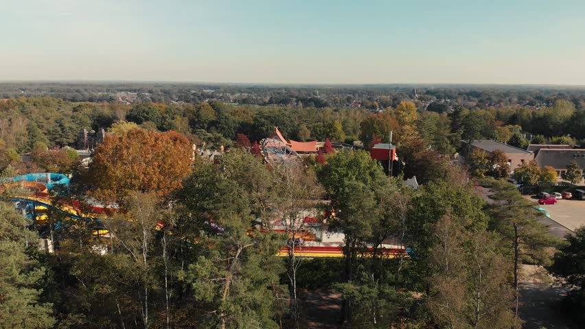 Aerial drone shot of a recreational and adventure park in Hellendoorn, The Netherlands, in the middle of a forest
