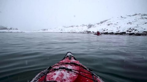 Kayaking Along the Coast of Lofoten, Norway in Winter