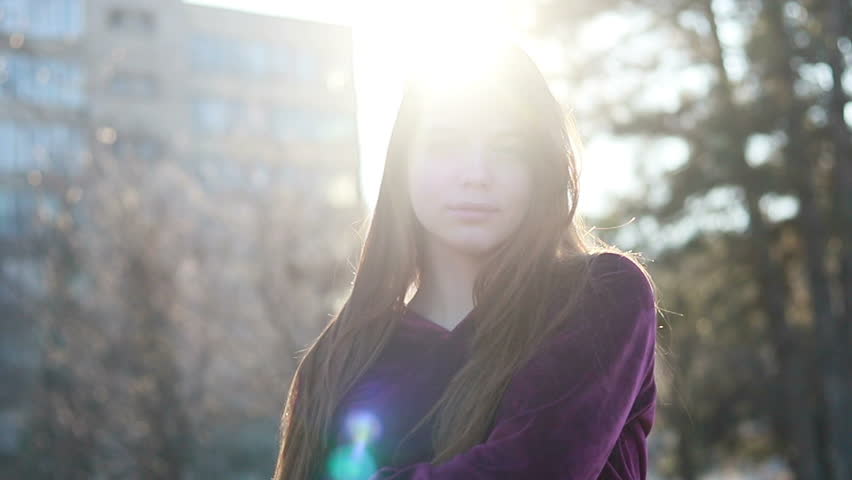 Sunshine young smiling woman with hair look at camera smile walking in the city streets portrait happy slow motion summer face sunset beautiful lady outdoor closeup cute.