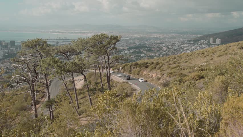 Motor vehicles make their way up the side of Table Mountain twisty road in Cape Town, South Africa.