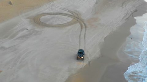 Aerial: Off-Road Vehicle Doing Donuts in the Sand in Caesarea, Israel