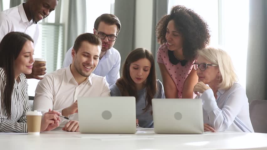 Male caucasian mentor teacher training business team interns workers gather discuss online project in teamwork, employees group listen manager talk explain computer work at corporate office meeting Royalty-Free Stock Footage #1029051446