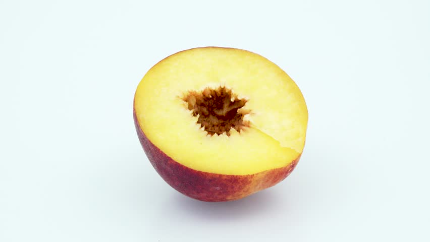 Peach half without seed center frame in 4k 3840 x 2160 Rotating Loop-able 360 Degree Rotation
