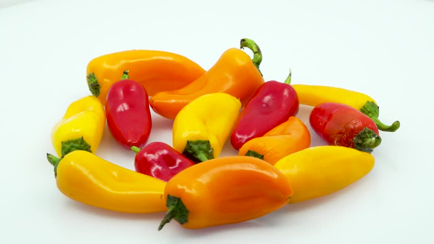 Bunch of Sweet Peppers Center Screen in 4k 3840 x 2160 Rotating Loop-able 360 Degree Rotation