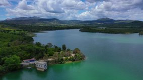 Aerial drone panoramic view video of famous dam and lake of Marathon with beautiful clouds, North Attica, Greece