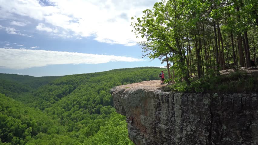 Tourist visitors family group taking selfie picture at Whitaker Point rock cliff hiking trail, landscape view, Ozark mountains, nwa northwest arkansas