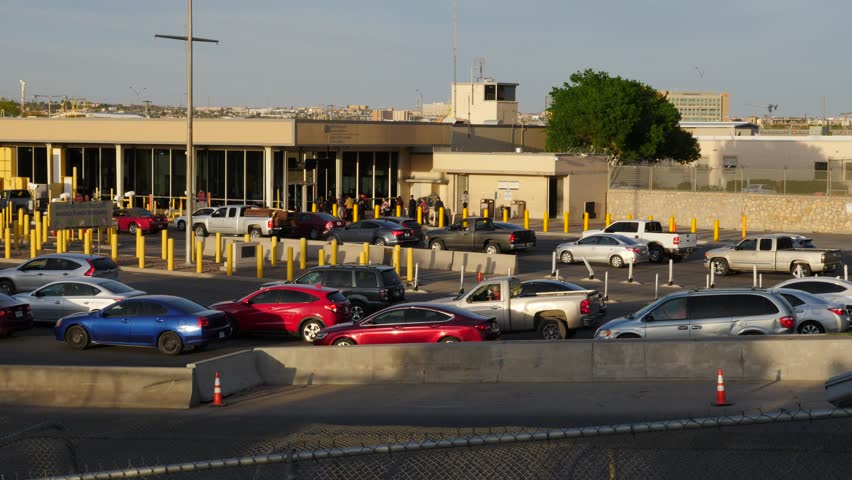 CARS AND IMMIGRANTS TRYING TO ENTER THE UNITED STATES IN EL PASO TEXAS