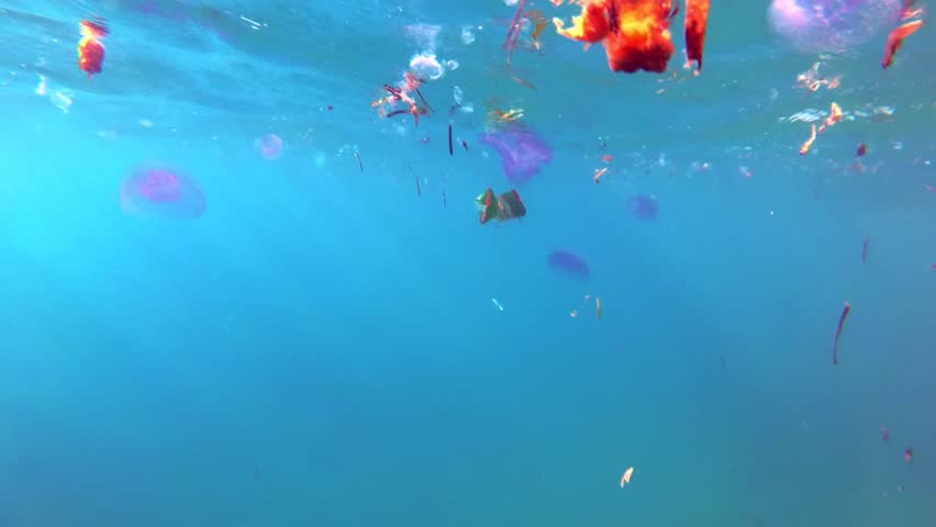 Floating plastic rubbish, Garbage, bags and disposable cups on surface of water. pollution of seas and oceans, Environmental problem. harm to marine life, residents.