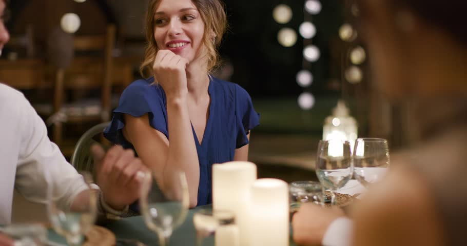 Four people, two couples happy talking and eating during a romantic gourmet dinner or lunch.Medium shot. Friends italian trip in Umbria.4k slow motion | Shutterstock HD Video #1029075065