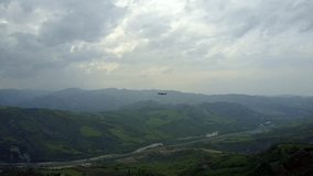 Drone flying with mountains landscape background.