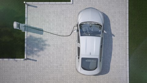 charging electric car at home top down aerial view