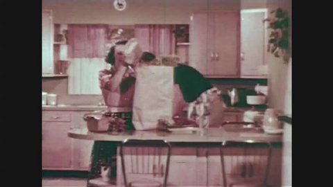 CIRCA 1950s - The home economist demonstrates how to properly seal meats for freezer storage.