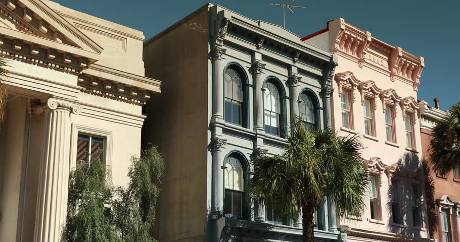 Row of old historic downtown business buildings on Broad and Meeting streets in Charleston South Carolina USA