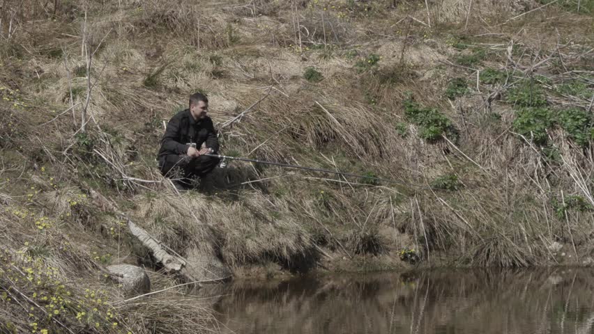 lonely man fishing in the pond