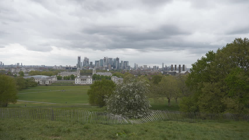 An overlook of a green park on a gloomy day in London.