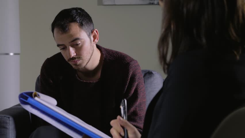 depressed man talking with the psychologist.Mental helath,Therapy session