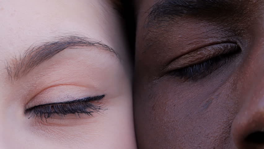 Black man and white woman's eyes opening.Interracial race love concept-macro | Shutterstock HD Video #1029159227