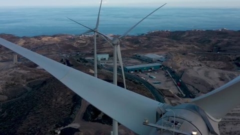Close look at windmills generating green energy Aerial view 4K