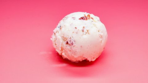 side view chestnut and red bean ice cream ball melting timelapse on pink background