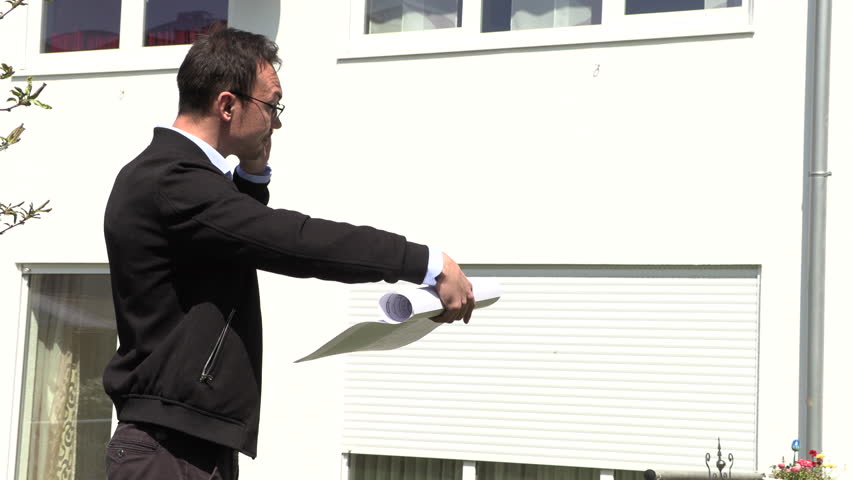 A real estate agent is waiting for a client