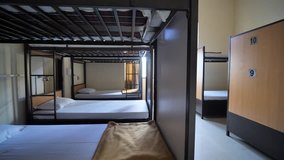 Empty room for a cheap hostel with bunk beds. - Powered by Shutterstock - Get 15% off with code: PIKWIZARD15