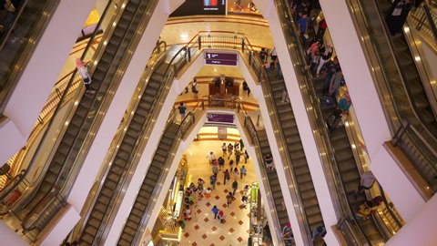 kuala lumpur city center famous mall hall crowded escalators panorama 4k malaysia