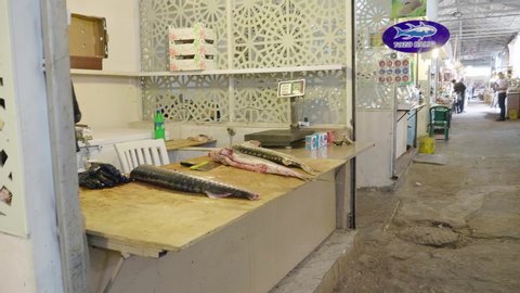 Baku, Azerbaijan - Circa 2019: Corridor passage Taza bazaar in central Baku - market stalls selling fresh sturgeon and black caviar