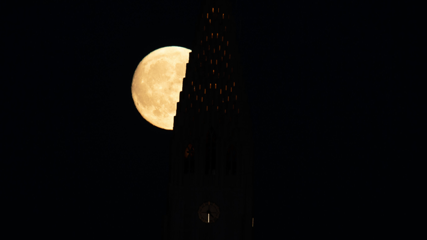 Full moon rising behind church steeple Reykjavik Iceland time lapse.mov
