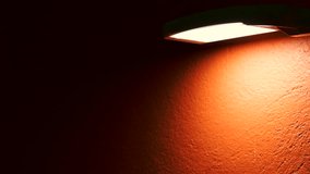 4K video of lamp with orange background