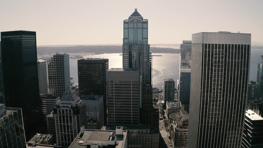 Seattle downtown, skyline with skyscrapers, highrise office and residential buildings with Elliott Bay waterfront and Puget Sound in the background