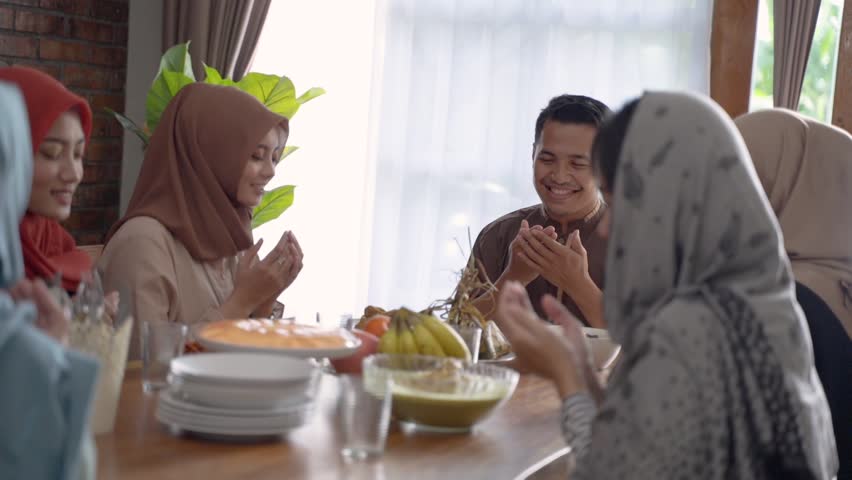 The muslim family prayed together before breaking the fast at home Royalty-Free Stock Footage #1029198281