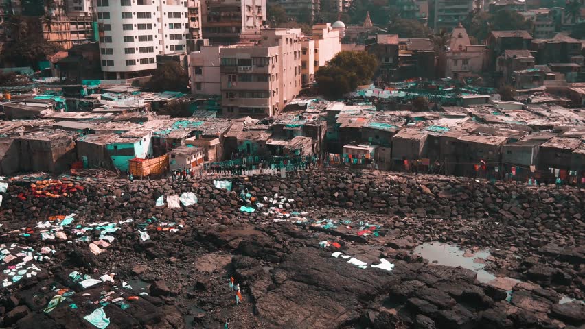 Mumbai, India, "dhobi ghats" slums near ocean, 4k aerial drone footage teal and orange