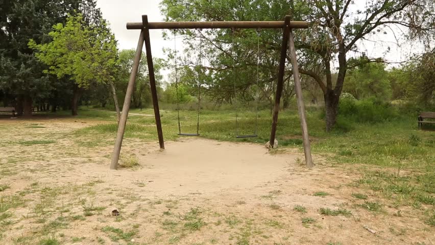 Landscape with swing on a cloudy and windy day