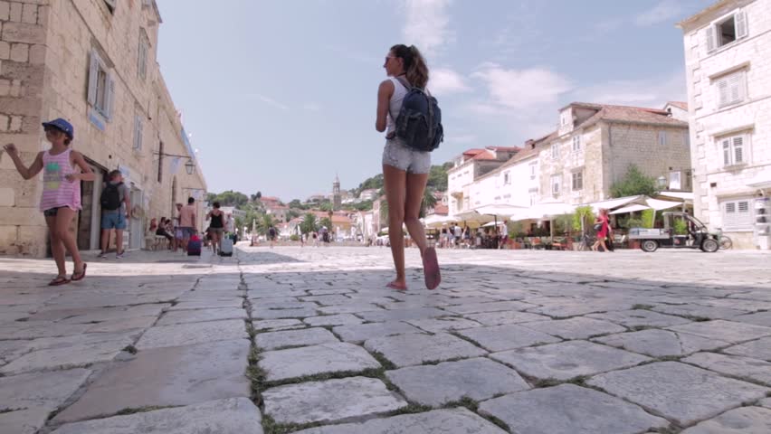 Handsome girl taking a walk in the city of Hvar