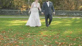 Adorable Bride And Groom Walk Towards The Camera Laughing, Slow Motion Newlyweds Walking And Looking At Each Other Smiling, Wedding Day Bliss