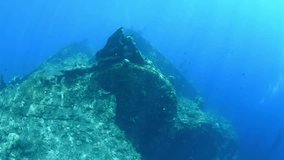 Sunken ship near the coast of Bali. Artificial reefs and coral gardens - fantastic underwater world. Diving and snorkeling in Bali.