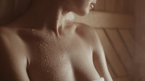 girl in the spa sauna relaxes, close-up skin with drops of sweat on it.