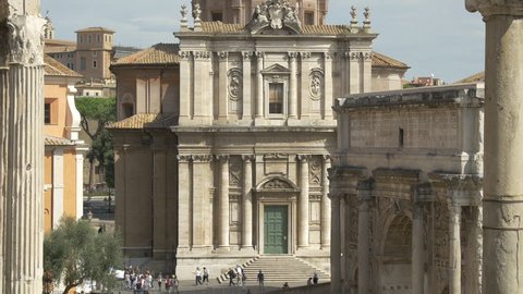 Italy, Rome - September, 2016: Santi Luca e Martina Church facade and the Roman Forum ruins in Rome