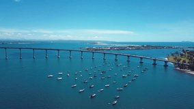 Aerial Video of Coronado California, Coronado Bridge, Boats In Harbor In Downtown San Diego, California. Smooth, stunning 4K HD Drone Video.