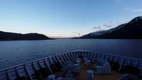 Timelapse of a ship going throw Norway landscape at sunset