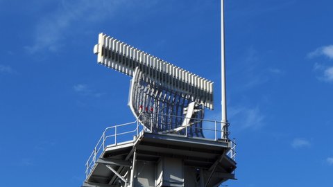 Airport radar transmitter tower used for air traffic control  of aircraft movements in the surrounding airspace. 