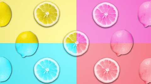 Abstract color animation of sliced lemon and different pastel rotating backgrounds. 4K seamless loop clip art fruit footage. Set of differen colors. Video Stok