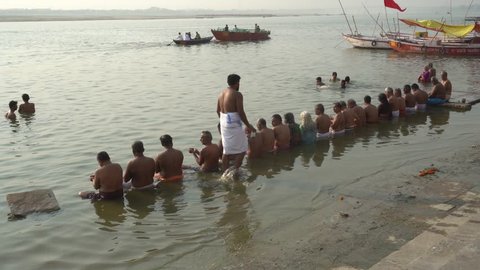 Varanasi / India 23 April 2019 Devotees from South India perform rituals for the salvation of their ancestors at the banks of sacred river Ganges in holy city Varanasi Uttar Pradesh 